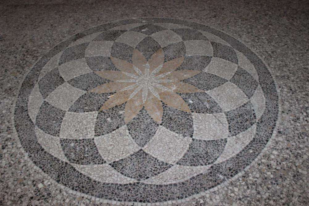 Terrazzo floor with a star rosette in the centre of the room